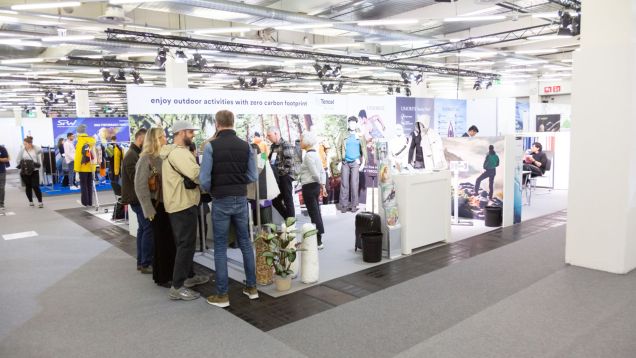 Detail of an exhibitor stand with visitors at PERFORMANCE DAYS April 2022
